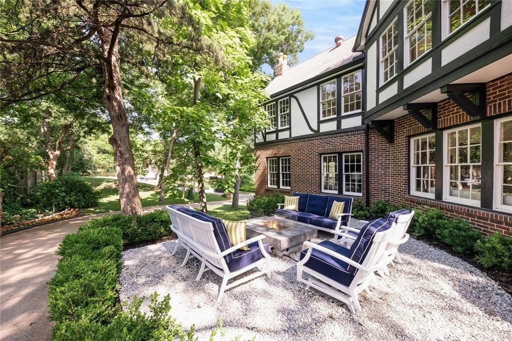 A towering Cedar tree shades the home's private patio. 
