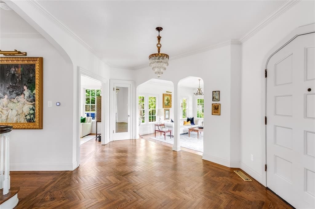 Arched doorways and crown moldings guide you throughout the home’s 3,000 square feet.