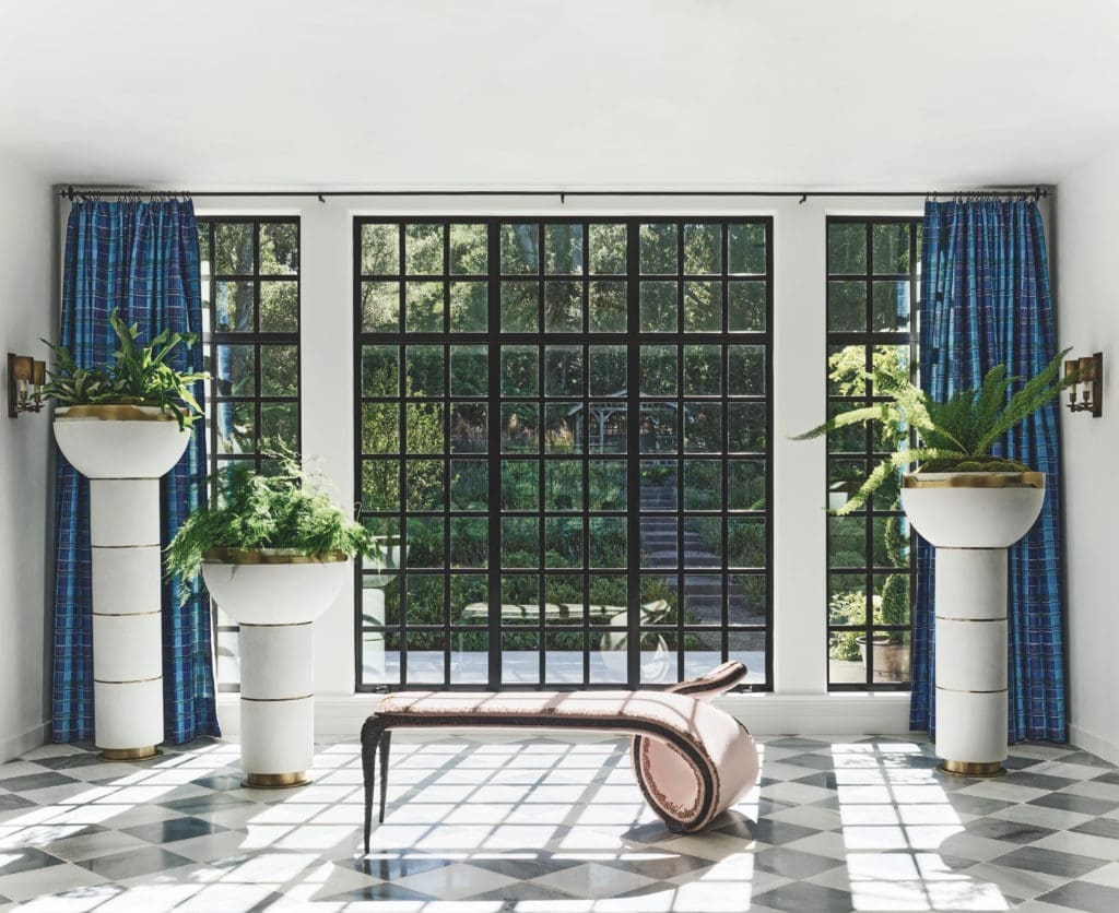 A storybook Tudor estate on five acres in Silicon Valley was built in 1921 as the country estate of a prominent San Francisco family. A century later, it’s been reimagined by Ken Fulk as a full-time family home and injected with a heavy dose of fashion and rock-star details. Woven leather, embossed metal, and high-gloss lacquer live alongside collectible objects and artworks by Picasso, Cindy Sherman, Basquiat, and Barbara Kruger. (Photo by Douglas Friedman)
