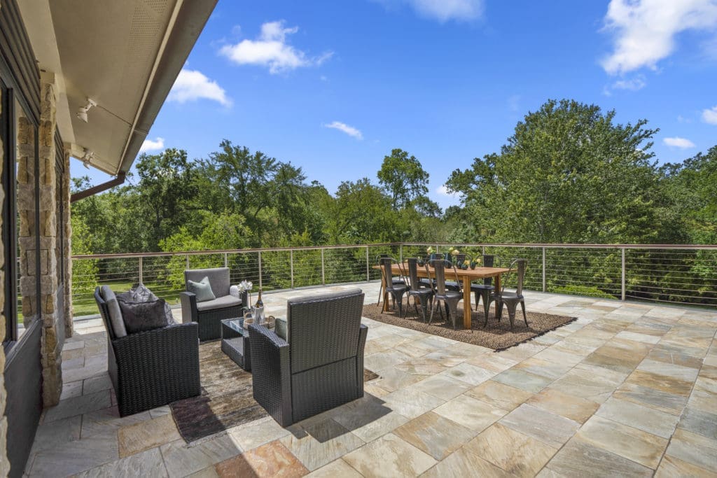 Second floor outdoor deck seating at 405 W. Spreading Oaks Avenue in Friendswood, the mansion originally designed for power house attorney Tony Buzbee