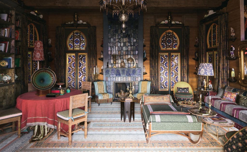 In a dacha in Normandy situated on the grounds of a neo-Gothic 19th century villa once owned by Yves Saint Laurent and Pierre Berge, is a pair of nineteenth-century sleeper chairs upholstered in Décors Barbares, Fortuny and Le Manach with Houlès piping. Set of eight 3D-printed, custom-designed JLD stained and sandblasted pin shelves. Set of nine antique samovars. Ceramic stove designed by JLD, created by by Nikolai Koshelev. Bronze-cast mushroom shelves for traditional Russian fashion figurines