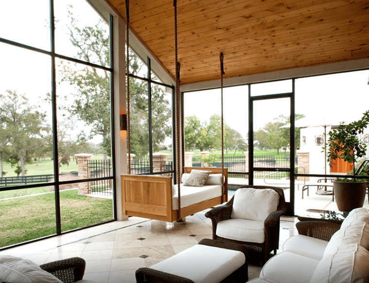 Each hacienda at the Inn at Dos Brisas has a fully furnished screened porch with a heavenly swing bed. (Photo by Julie Soefer)