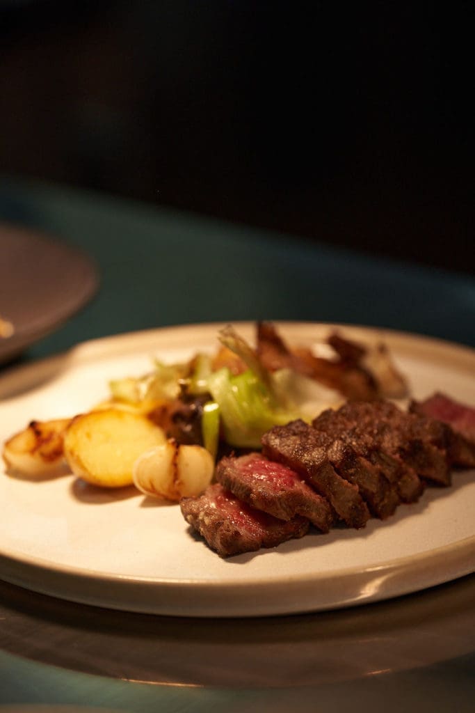 One of the final courses was a mouthwatering A5 Wagyu Kagoshima steak with potato and mushroom confit (Photo by Studio Caribe)