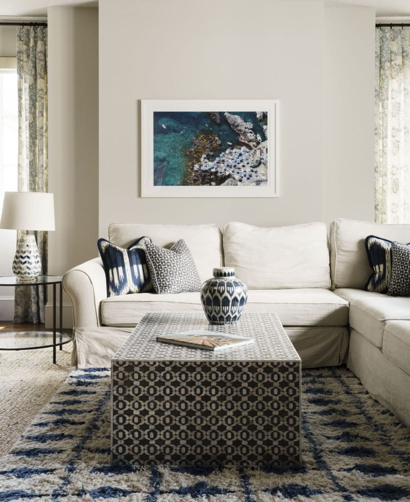 The Annie Selke area rug and Wisteria coffee table are focal point of the playroom. (Photo by Jack Thompson)