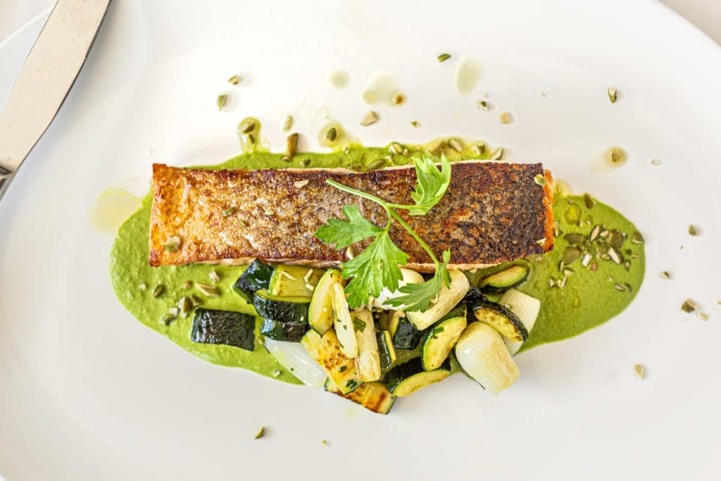 The Scottish salmon entree is served with a green mole, zucchini and pumpkin seeds at The Annie Cafe and Bar. (Photo by Jenn Duncan)