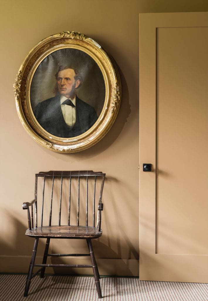  In the boys’ bedroom, a portrait discovered in Belgium. The chair
is a contemporary reproduction of a 19th-century one designed by Roy Flanders. (Photo by Jack Thompson)