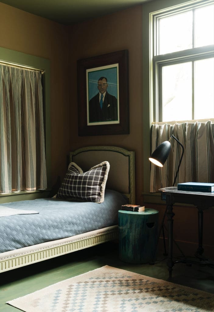 In the bedroom, the vintage rug is Turkish. Curtains are Ralph Lauren fabric. Painting from Belgium. (Photo by Jack Thompson)