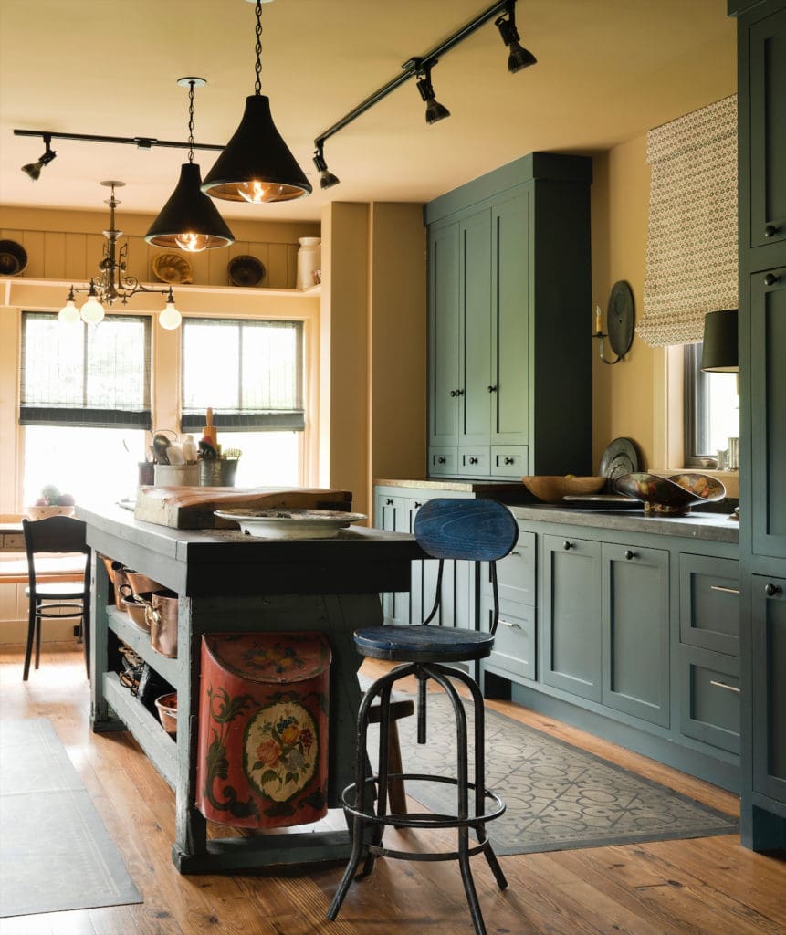  Jill Brown designed the Shaker-style kitchen cabinets. The countertops are bluestone from Belgium. Light fixtures from Brown House and Wares. (Photo by Jack Thompson)