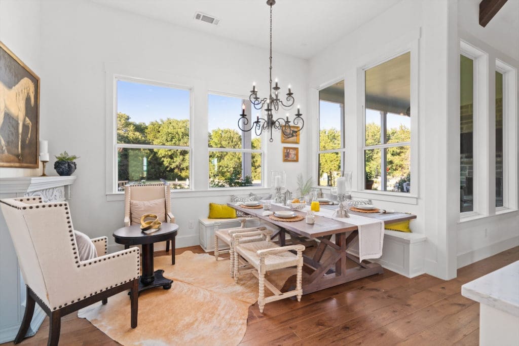 Extra seating was added just off the kitchen for a sunny dining nook. (Photo by Sharp Frame Media for Douglas Elliman Realty)