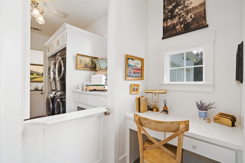 A Dutch door leads the way to the laundry room. (Photo by Sharp Frame Media for Douglas Elliman Realty)