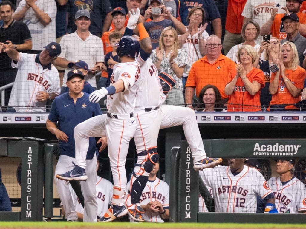 Alex Bregman and Martin Maldonado know how to celebrate big moments. They produce plenty of them. (Photo by F. Carter Smith)