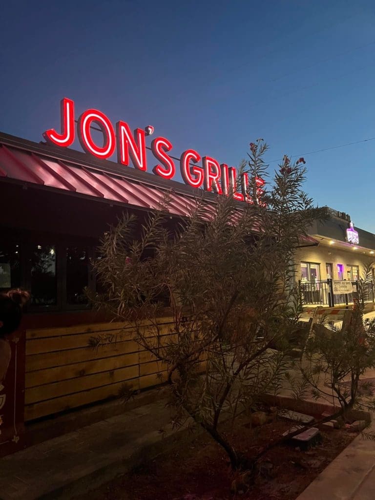 The neon signage has been installed at the new Jon's Grille along Berry Street in Fort Worth.