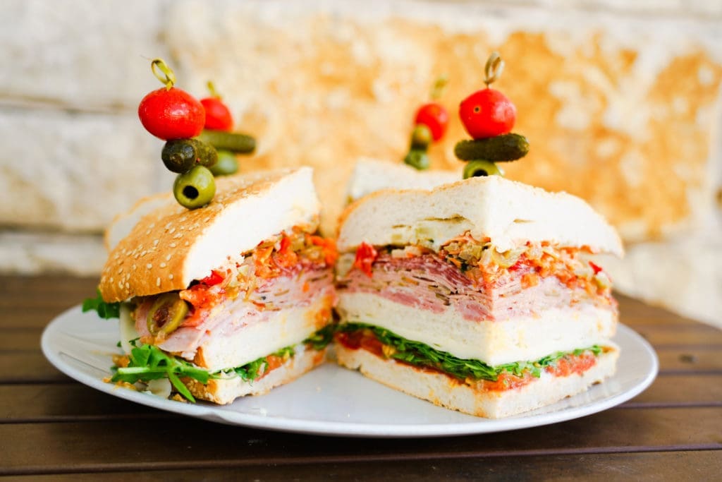 The Big Muffuletta at Lagniappe Kitchen and Bar lives up to its name as it is available all-day in three sizes, big, bigger and biggest.  (Photo by Mikah Danae)