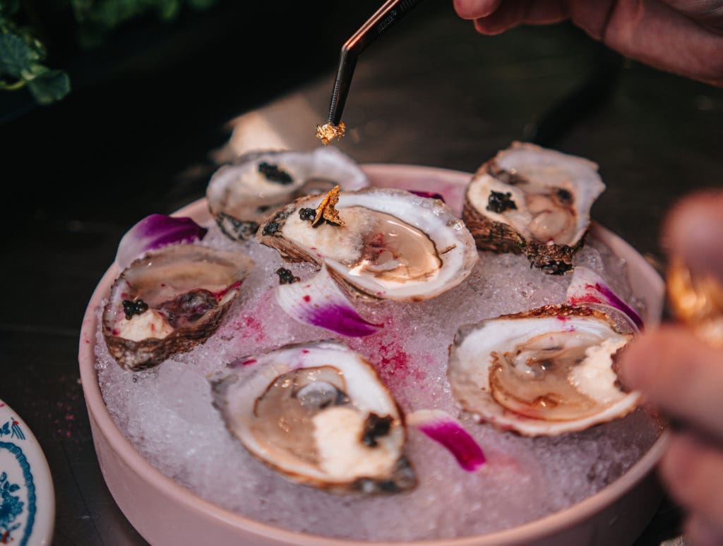 At Rosland's they bring in oysters from the East Coast and here they pair it with champagne in their appetizer dish, Oysters and Bubbles. (Photo by Raydon Creative)
