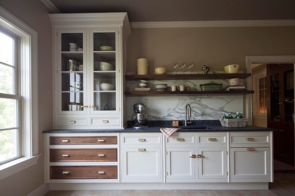 The newer trend seems to be a mash up styles, incorporating traditional elements with sleeker modern ones. Courtesy of Christopher Peacock.