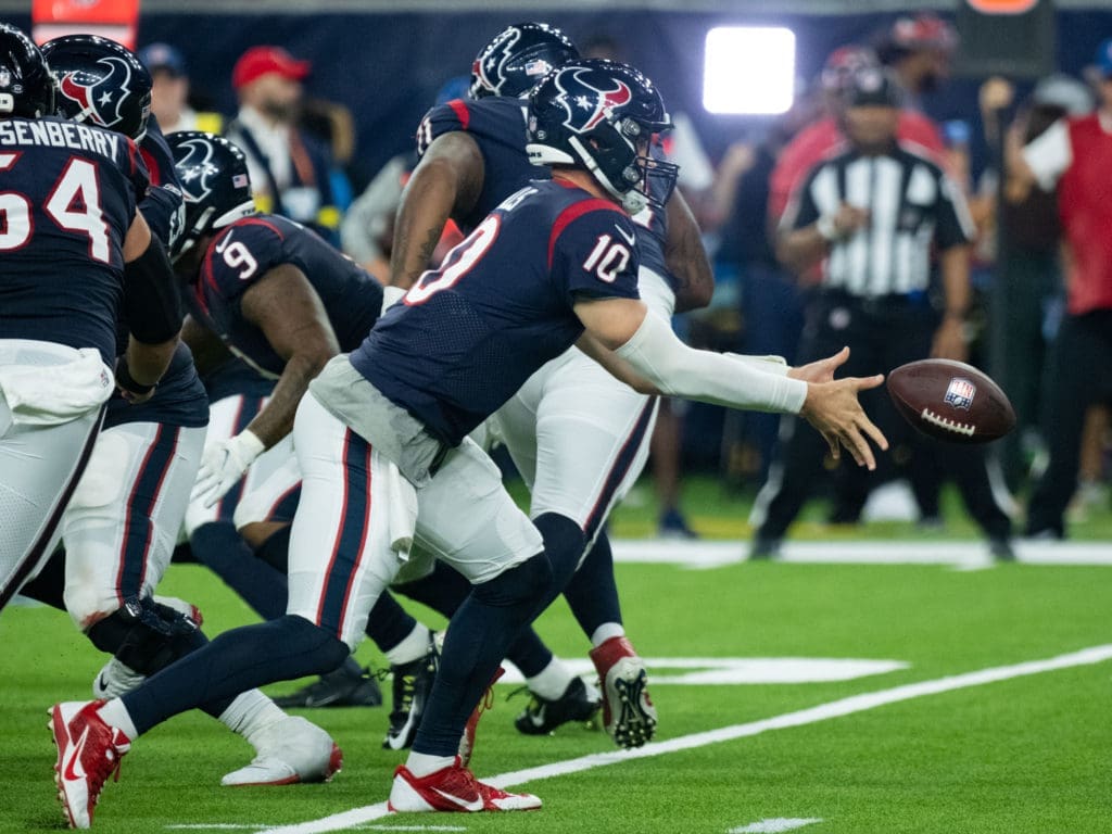 Texans quarterback Davis Mills needs a good running game to succeed. (Photo by F. Carter Smith)