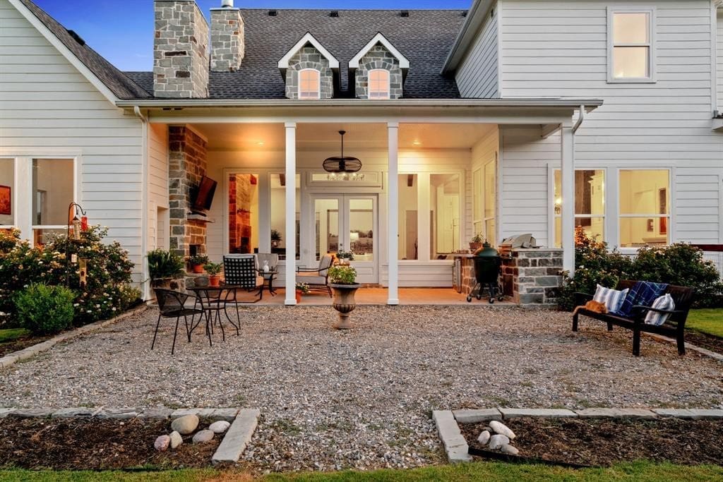 Enjoy sprawling ranch views from the well-appointed back porch. (Photo by Sharp Frame Media for Douglas Elliman Realty)