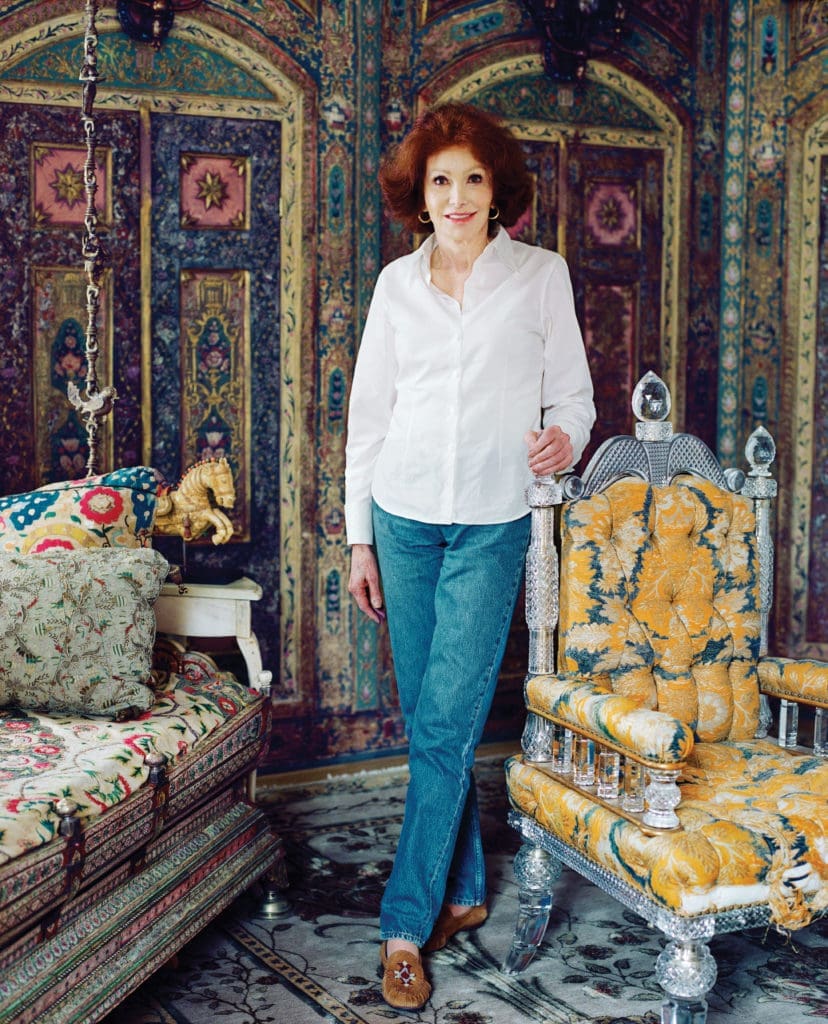 Ann Getty in the Syro-Turkish guest bedroom of her San Francisco residence. The 1894 chair, crafted in fine cut crystal, is by F. & C. Osler, Birmingham, England. It was a design destined for European royalty and maharajas. The gold leaf, paints, and traditional tools are those used by specialist artists restoring antiques at the house. Among Getty’s favorite designers are Elsie de Wolfe, for her lighthearted yet dramatic approach to design; Sister Parish for her never-overthought but always sophisticated and comfortable rooms; and Tony Duquette for his lavish whimsy.