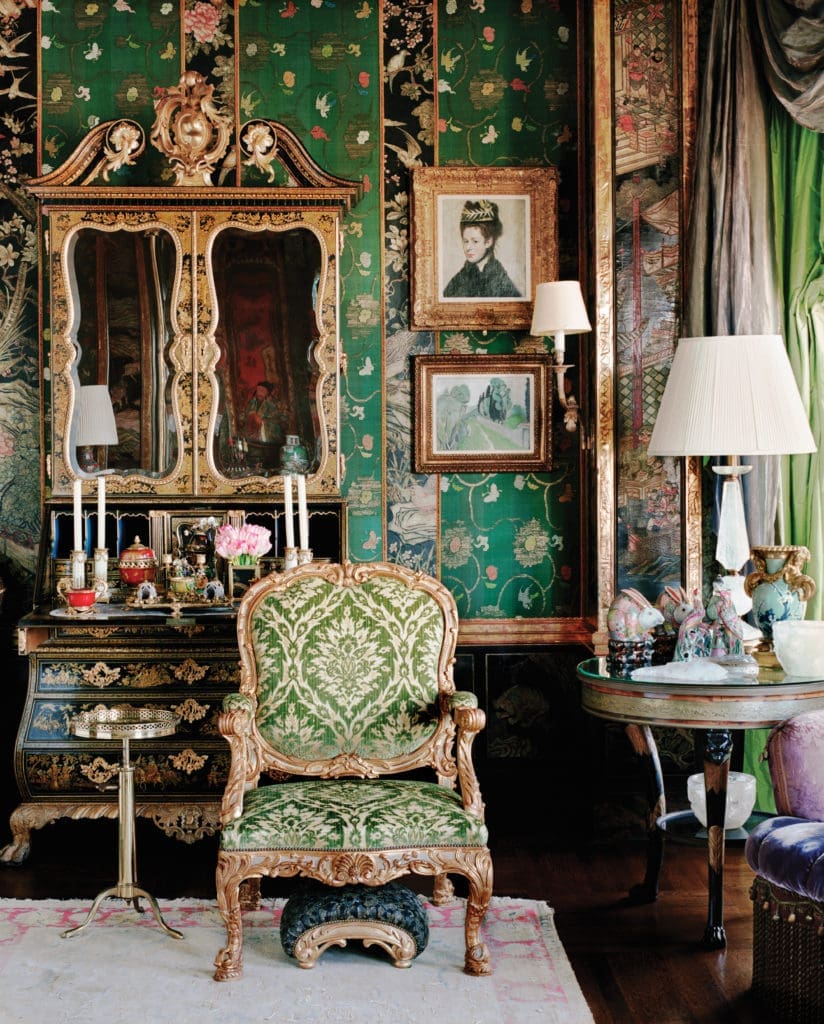 The circa-1740 green- and gold-japanned and carved giltwood
cabinet is attributed to Giles Grendey, one of the greatest 18th-century English cabinetmakers. It's crowned with a swan-neck molded pediment centered by a pierced, carved giltwood cartouche and a baroque cabochon. On the right, "Buste de Femme au Chapeau à Plumes," 1887, by Edgar Degas. (Photography by Lisa Romerein)