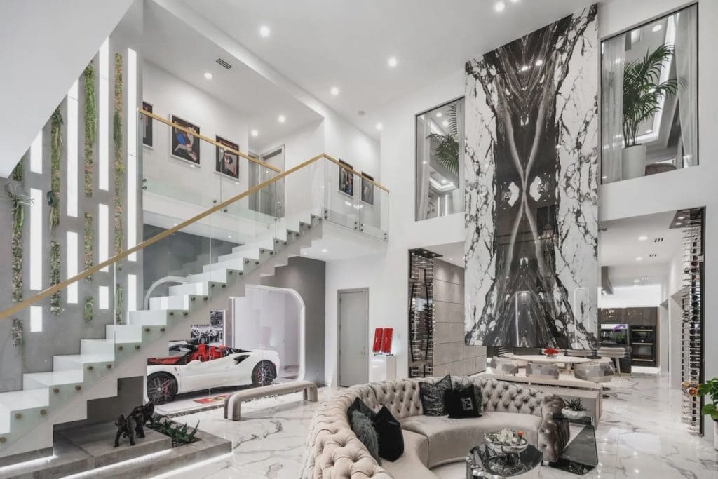 The great room is filled with Italian porcelain tile and custom furnishings by  homeowner Michael Shaun Jackson. 