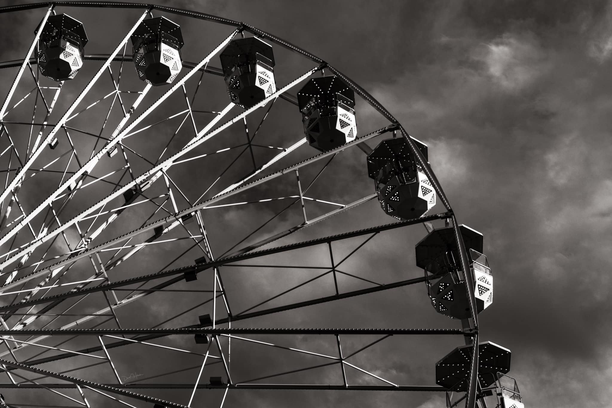 This black and white photograph of the Ferris wheel at the Fort Worth Stock Show and Rodeo is chef taken. (Photo by David Hollister)