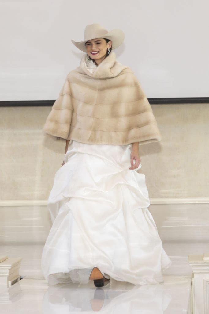 The grand finale: a cowgirl bride in a stunning fur by Chasseur NYC at the Desert Rose Luncheon and Fashion Show at River Crest Country Club in Fort Worth, Texas on October 6, 2022. (Photo by Sharon Ellman)