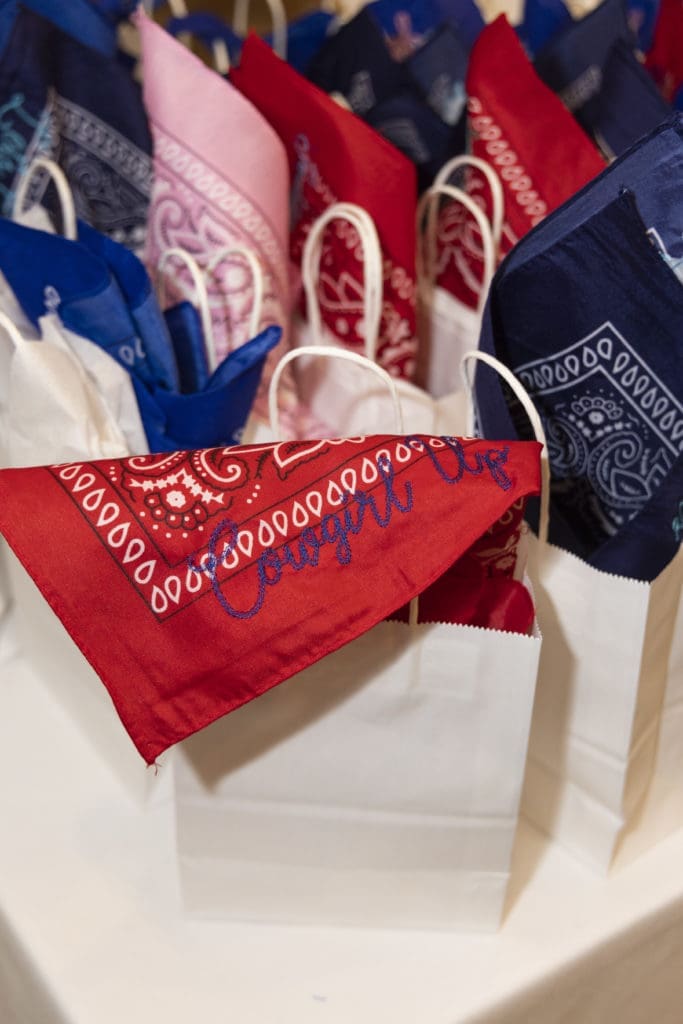 Gift Bags featuring bandanas embroidered with "Elaine's Eight" by Monogram Club at the Desert Rose Patron Party at River Crest Country Club in Fort Worth, Texas on October 5, 2022. (Photo by Sharon Ellman)