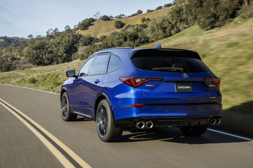 Quad exhaust finishers add the perfect punctuation point to the MDX Type S Advance, shown here in signature Apex Blue Pearl. (Courtesy Acura)