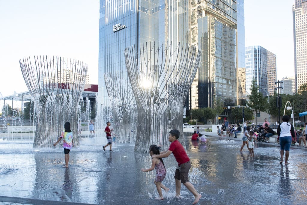 Children enjoyed playing in the fountain (Photo by Tamytha Cameron)