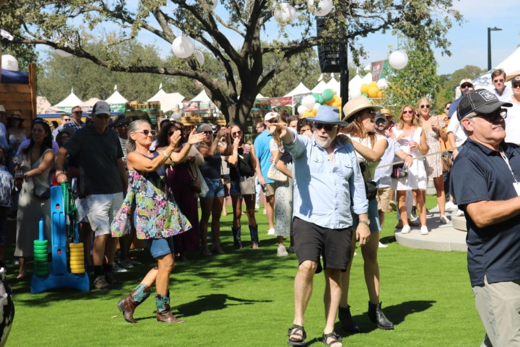 Part of the Chefs for Farmers fun in Autry Park was a dance-off with DJ spins. (Photo by Addison Hall)