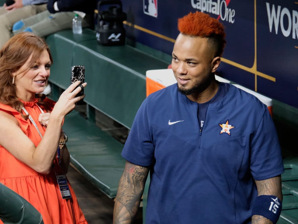 Astros catcher Martin Maldonado's hair color changes always draws a crowd of gawkers. Including excellent Astros sideline reporter Julia Morales in this case. (Photo by F. Carter Smith)