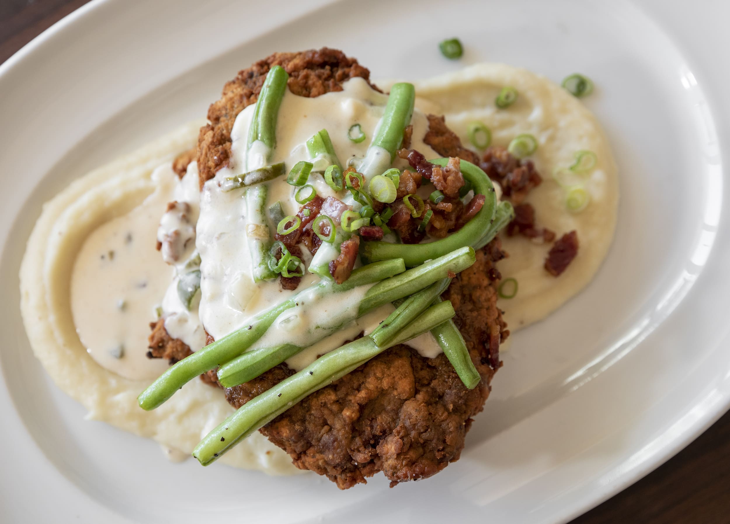 No ordinary chicken fried steak will do at Wild Oats. This one is created with Wagyu beef. (Photo by Claudia Casbarian)