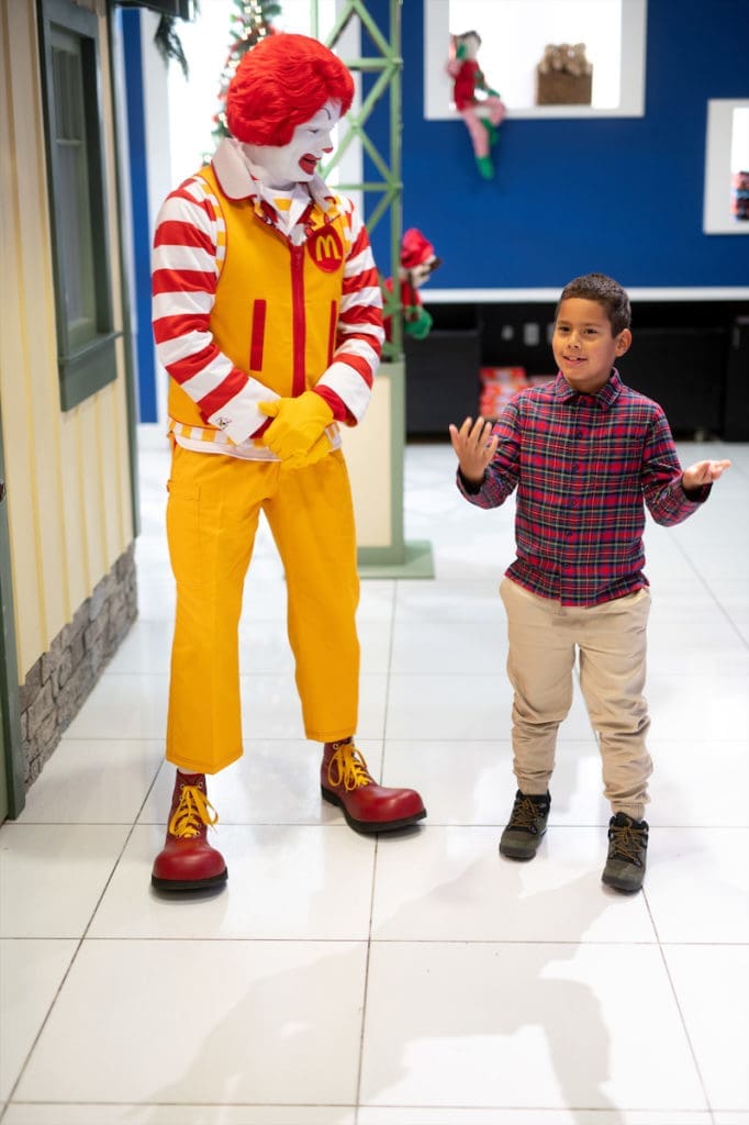 Ronald McDonald and Vasco Castaneda, the 2022 honorary kid conductor for the Trains at NorthPark. (Photo by Bret Redman)