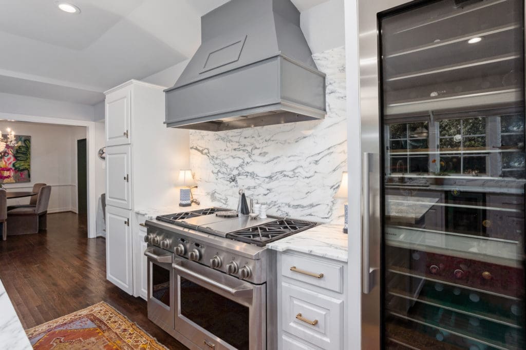 104 Crestwood - Kitchen fitted with industrial gas range and Miele wine refrigerator.