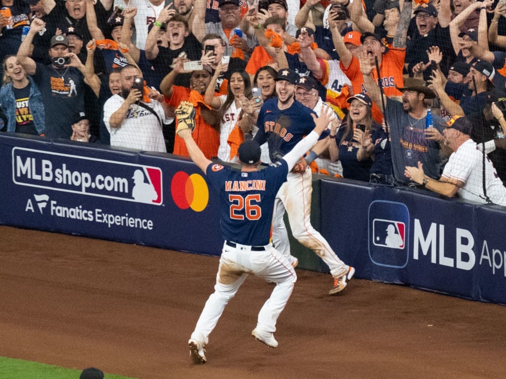 Kyle Tucker caught the final out and Trey Mancini couldn't wait to hug him. (Photo by F. Carter Smith)