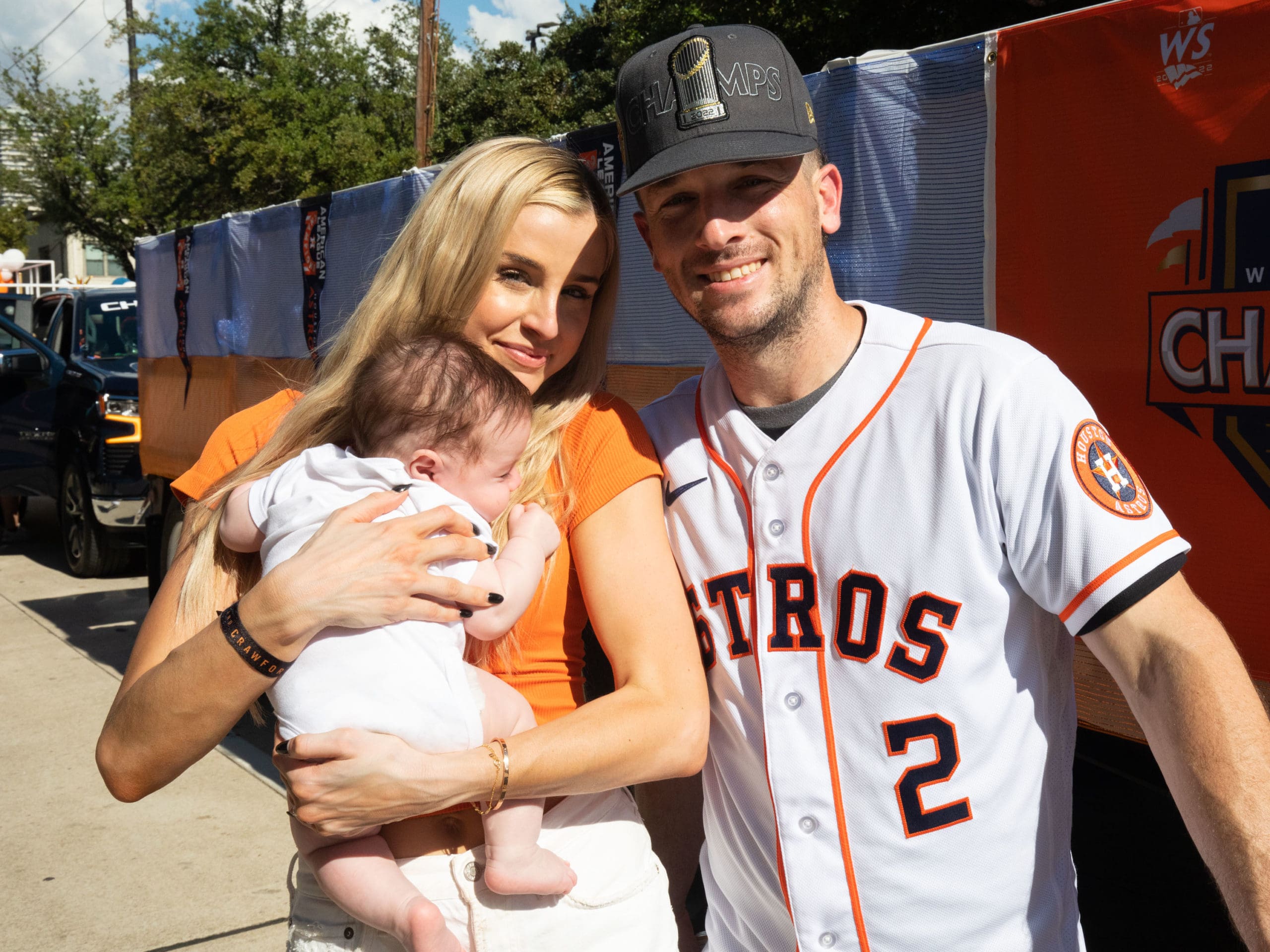 Reagan, little Knox, and Alex Bregman are enjoying the Astros' World Series' parade in 2022. (Photo by F. Carter Smith)
