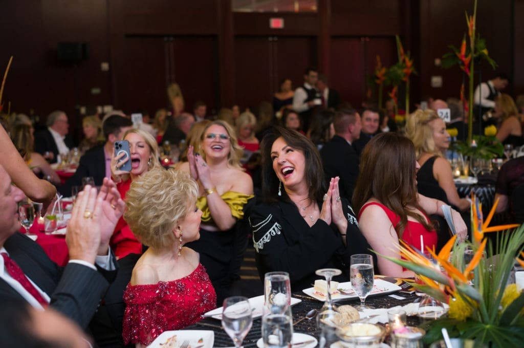 Alicia Smith and table mates, including Margaret Alkek Williams, rock with the HPFA Foundation party. (Photo by Daniel Ortiz)