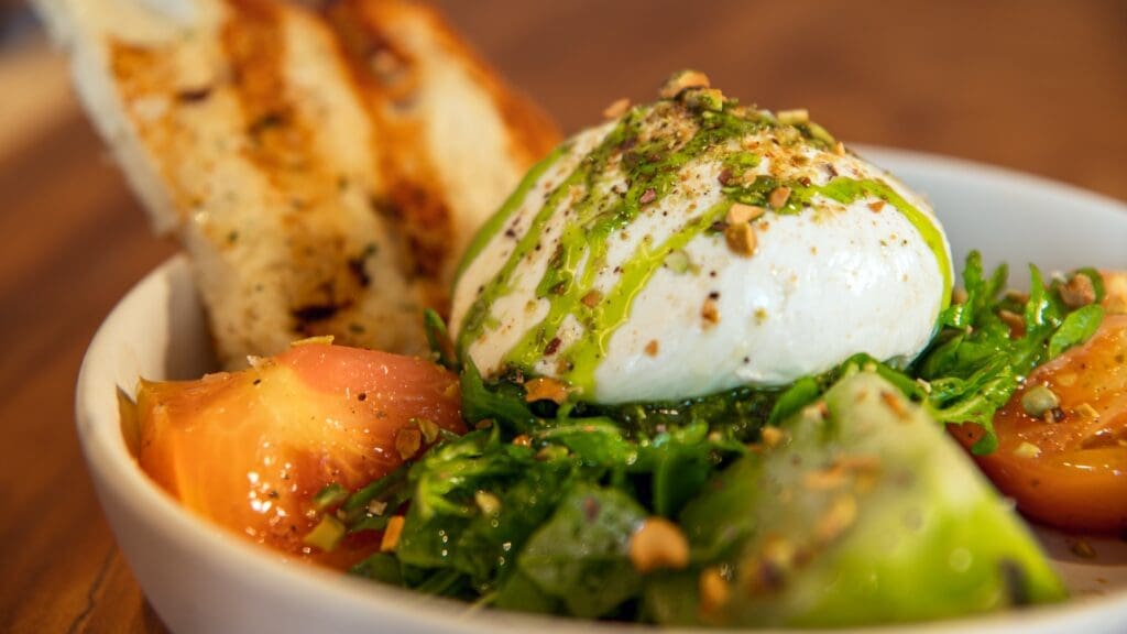 Burrata Caprese served with pesto and heirloom tomatoes is one of the dishes at Zanti. (Photo courtesy of Zanti Cucina Italiana) 