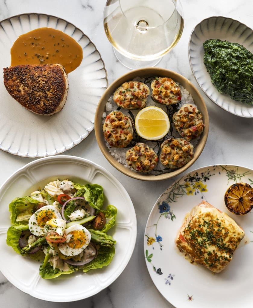 An array of seafood dishes (and otherwise) at the splashy new restaurant Navy Blue in Rice Village. (Photo by Julie Soefer)
