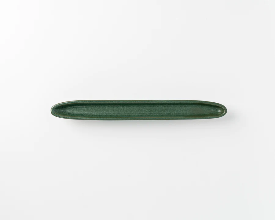 Gift someone a glazed porcelain tray for olives, chocolate truffles, or snacks. (Photo: HAAND)