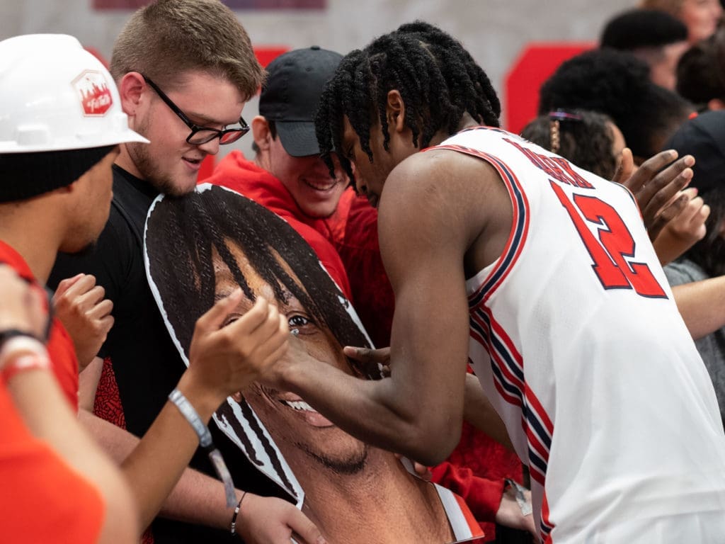 UH guard Tramon Mark found himself signing a giant photo of his face. (Photo by F. Carter Smith)