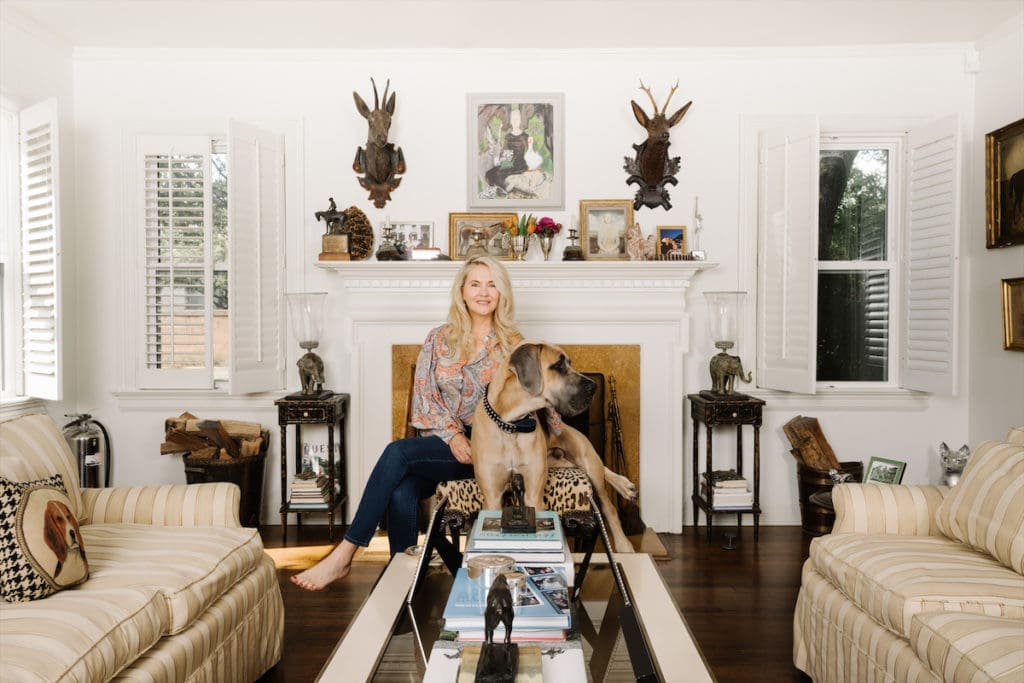 Cornelia Guest with her Great Dane, Wolf, in her Dallas living room. (Photo by Afritina Coker)