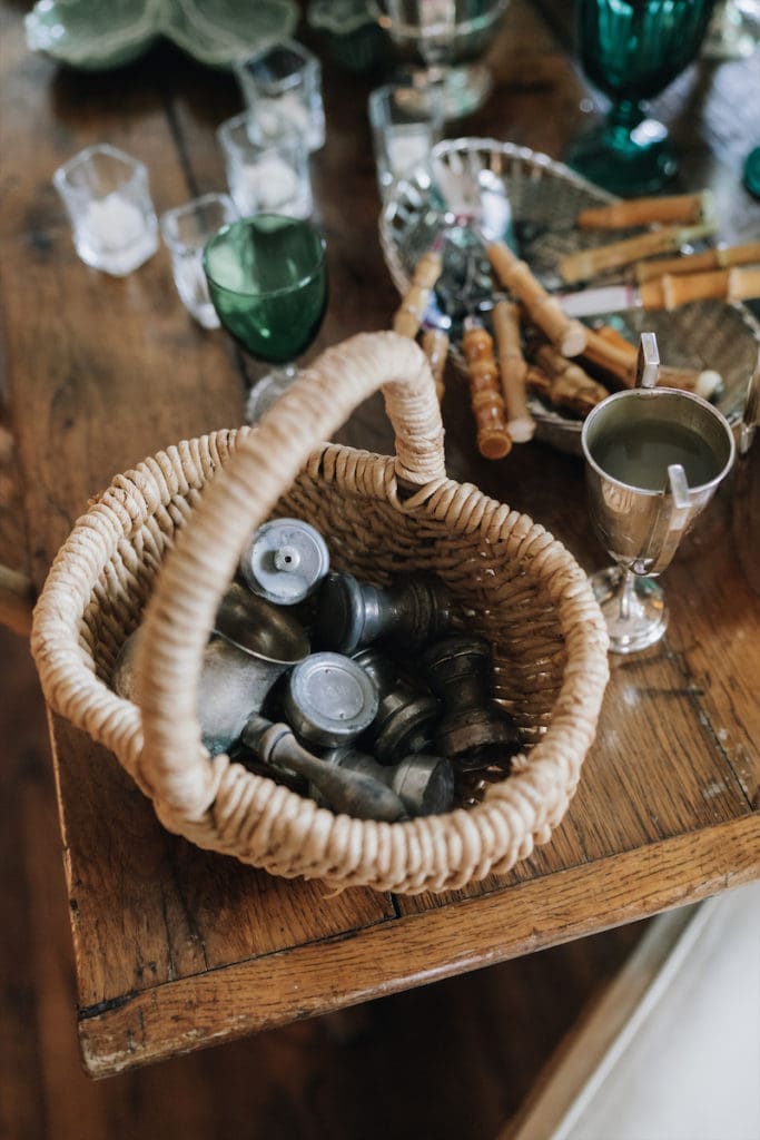 Vintage cutlery and other objects, including Winston’s silver polo trophy and a goblet that belonged to her parents, in their green racing colors. (Photo by Afritina Coker)