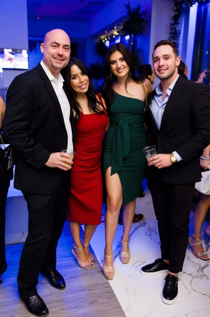 Charlie & Vanessa Kriegel, Jacqueline Davis, Taylor Webster at Construction Concepts Holiday Party for a Cause (Photo by Hung L. Truong Photography)