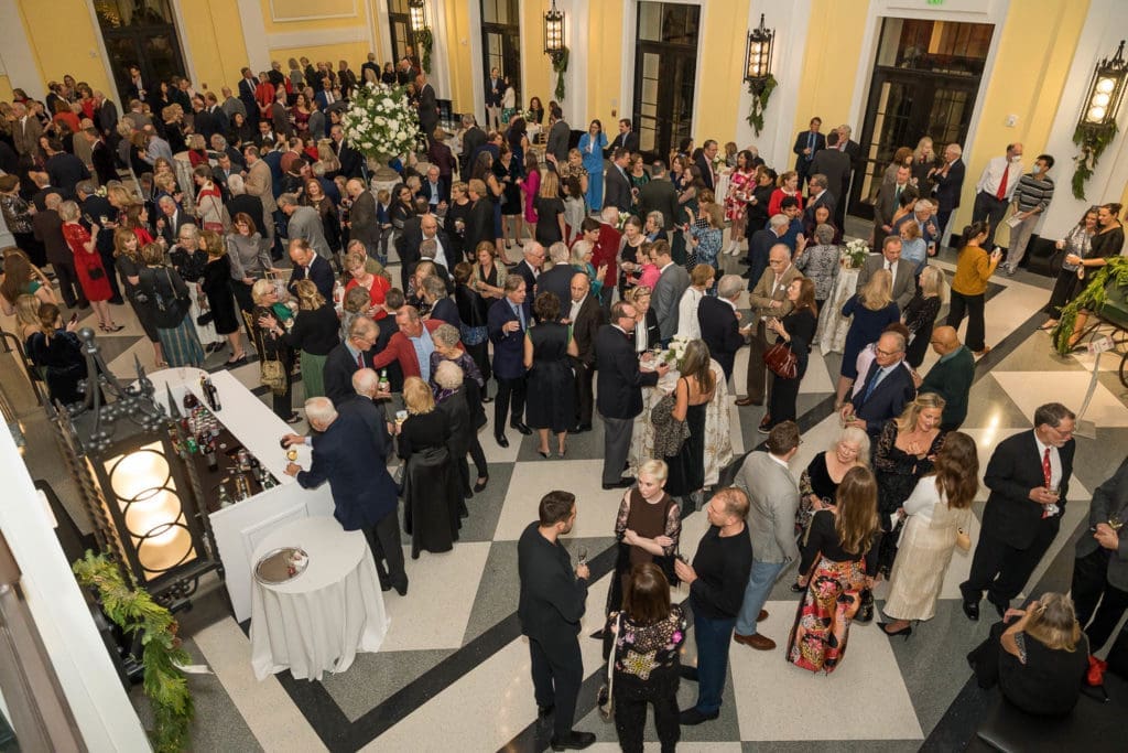 Guests gather in the Grand Foyer of Rice University's Brockman Hall for Opera for the Shepherd School of Music 'Spirit of the Season' event. (Photo by Trish Badger)