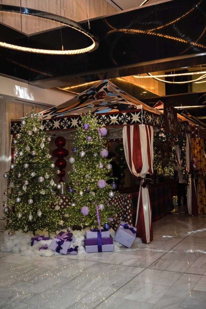 Thompson Dallas Holiday Market featuring live holiday jazz and a variety of elaborate food and beverage activations in the lobby.