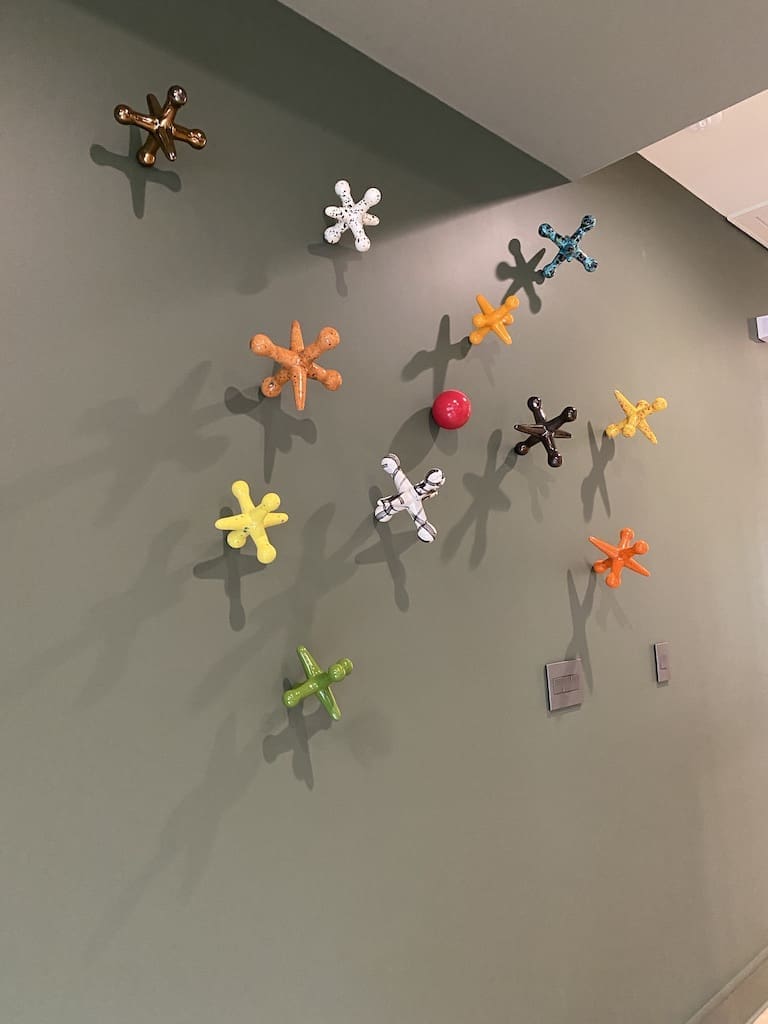 Over-sized jacks on the wall of the second floor family room in the ASID Show House.