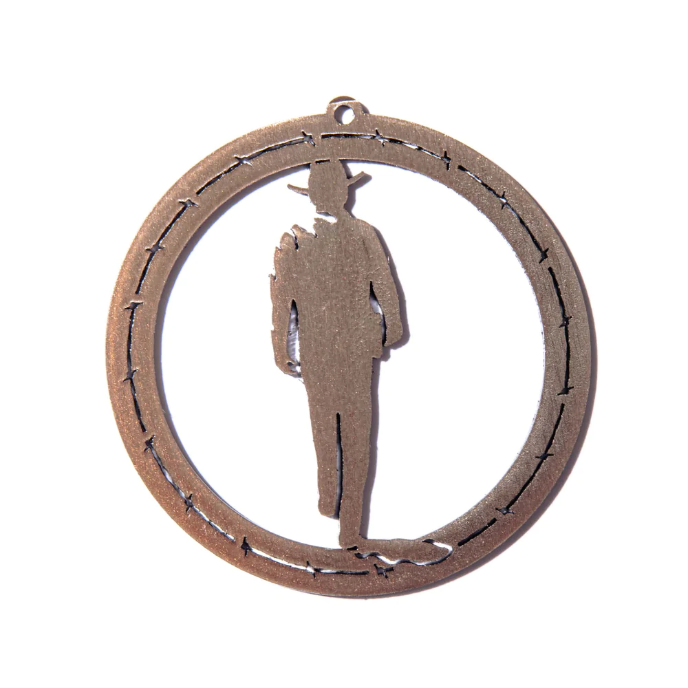 John Wayne silhouette ornament in copper tone.