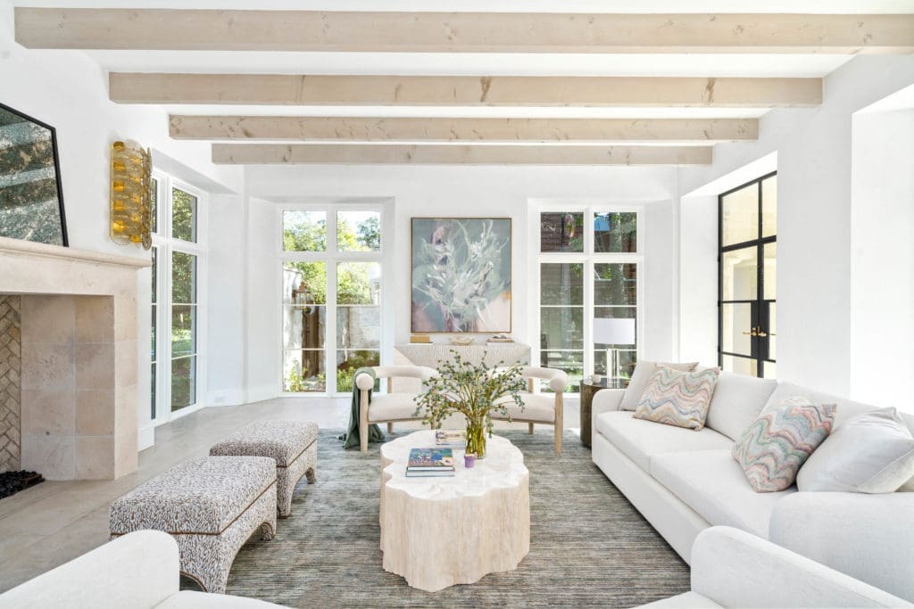 The main salon at 2445 Pine Valley Court with its 60" X 60" stone fireplace. (Photo by Sonya Bertolino)