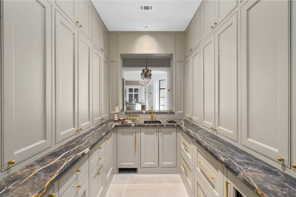 The wet bar at 2445 Pine Valley Court offers ample storage. (Photo by Sonya Bertolino)
